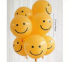 Yellow balloons with smiley face designs against a white background