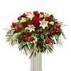 red and white color casket spray, lily, roses, orchid and seasonal flowers